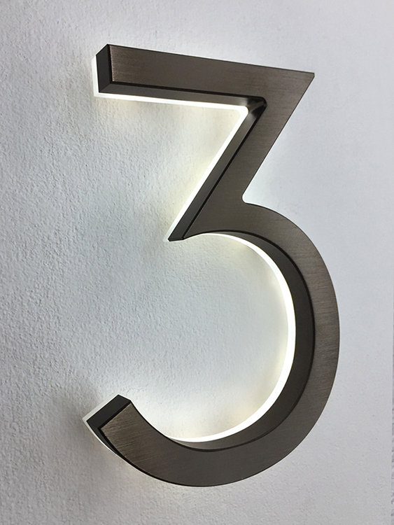 Modern neutra 8" bronze backlit numbers by Luxello LED Signage